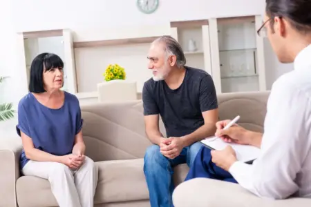 Two people in a family therapy session as part of addiction rehab