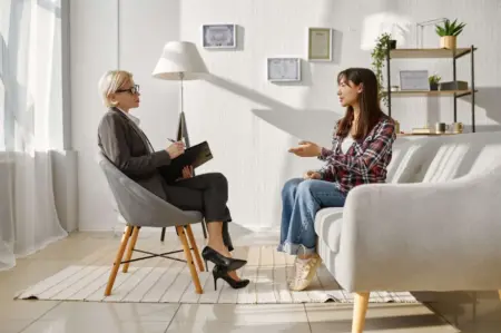 Profile view of a woman talking to a therapist