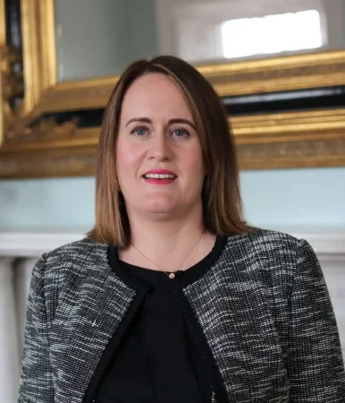 Portrait photo of Dr Orlagh McCambridge, taken indoors with golden framed mirror in the background