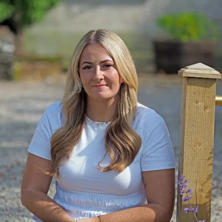 Portrait photo of Danielle Dyas, Staff Nurse, at Smarmore Castle taken outside in the sunshine