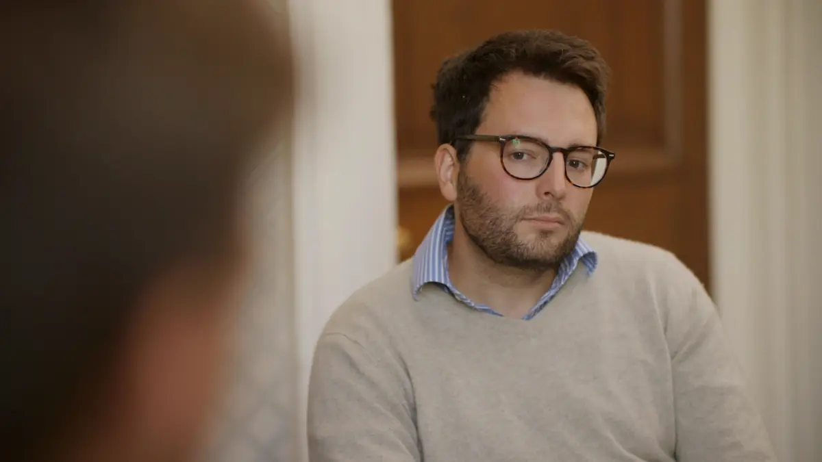 Close up of a man during a one to one therapy session for addiction while in rehab
